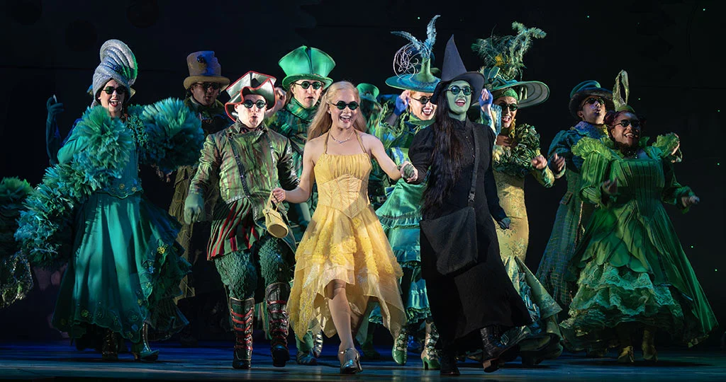 Claudia Bennett as Glinda and Aline Mayagoitia as Elphaba (center) and the North American Touring Company of WICKED, photo by Joan Marcus