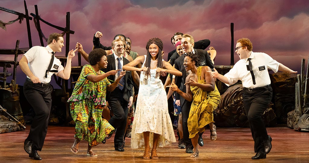 (L-R) Sam McLellan, Charity Arianna, Jacob Aune, and company in THE BOOK OF MORMON North American tour Photo by Julieta Cervantes